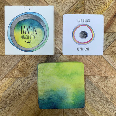 Watercolor card backs on the Haven Oracle compliment the colors on the box