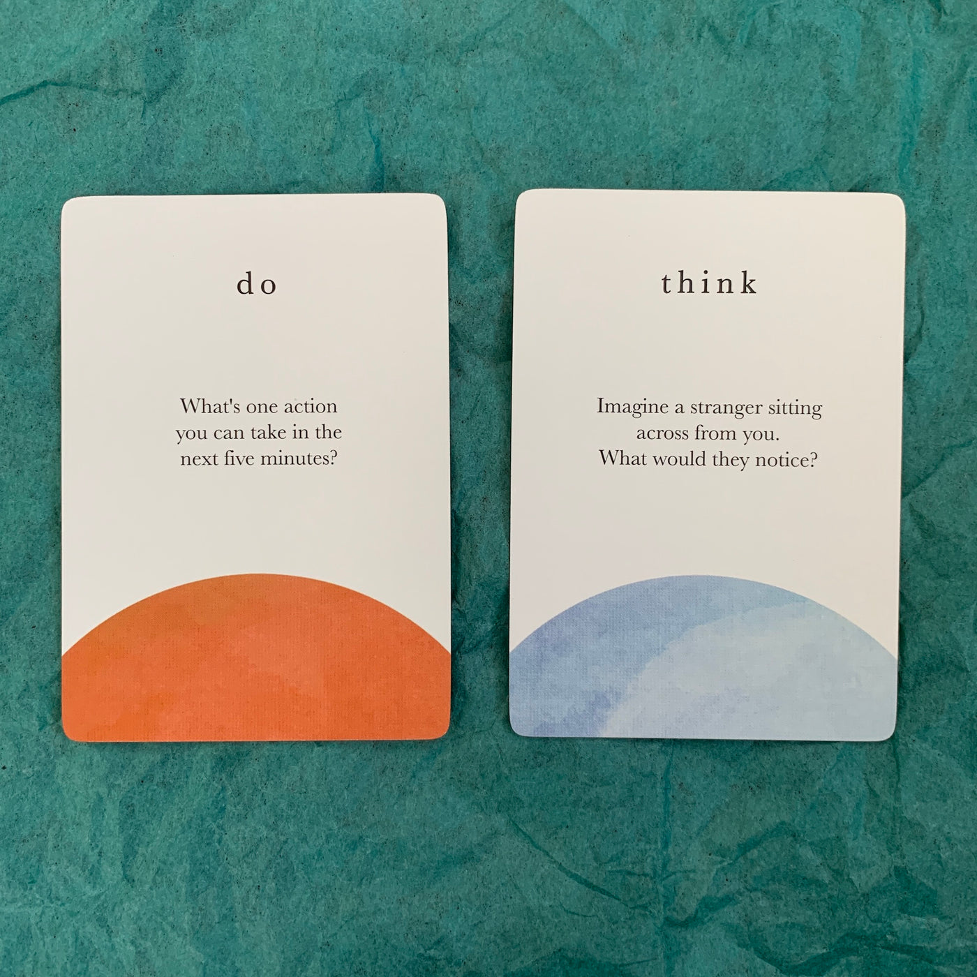 close-up of two cards from the compass cards deck